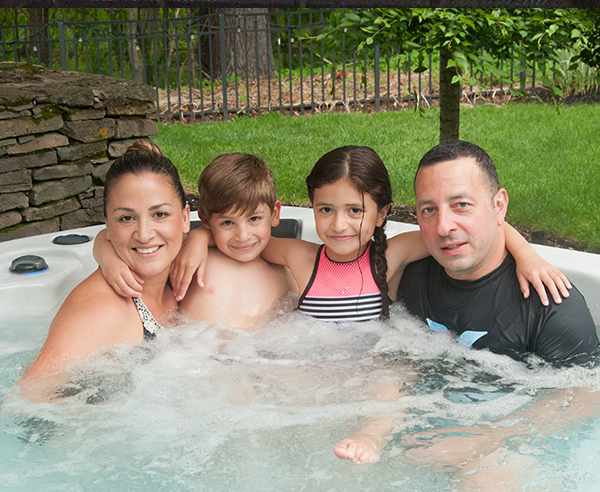 family smiling in spa