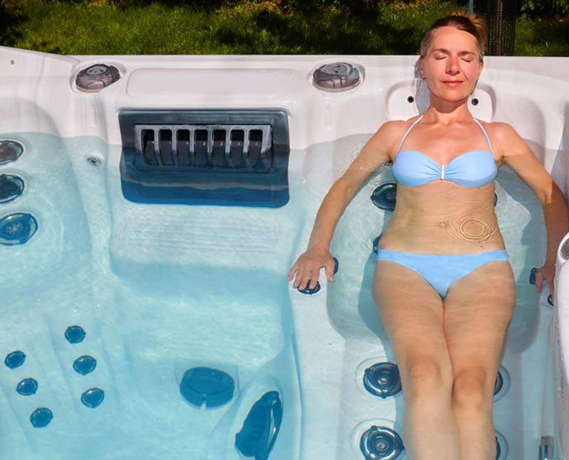 woman relaxing in hot tub